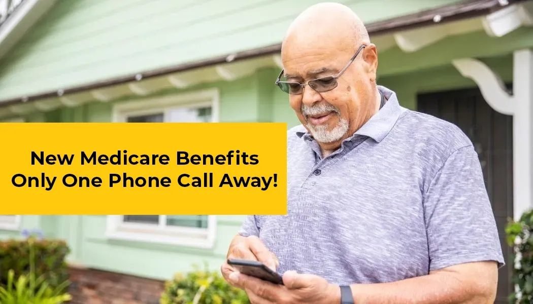 Senior man smiling while looking at his phone